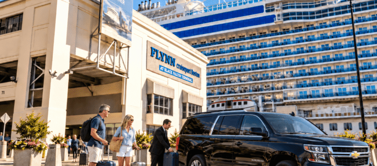 Chauffeur loading luggage into a black SUV for passengers at Flynn Cruiseport Boston