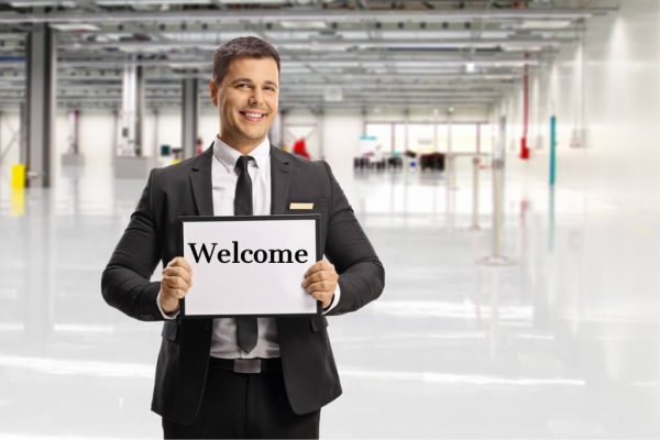 Logan Airport meet and greet car service with professional chauffeur assisting travelers